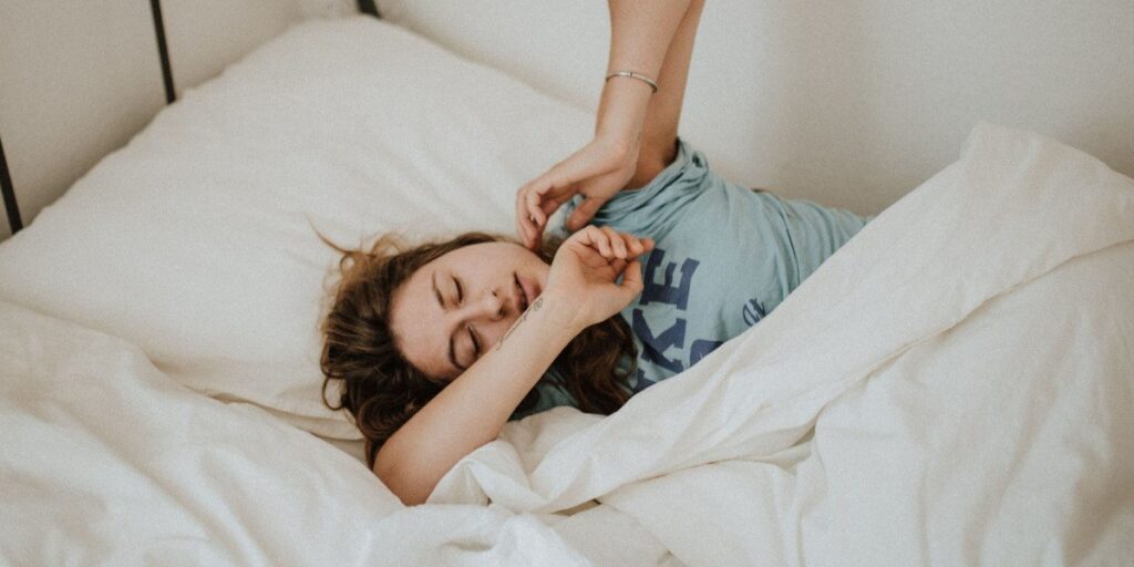 woman waking up in bed