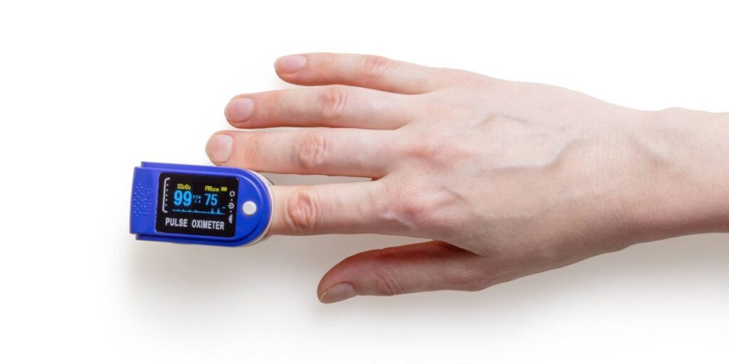 person using oximeter