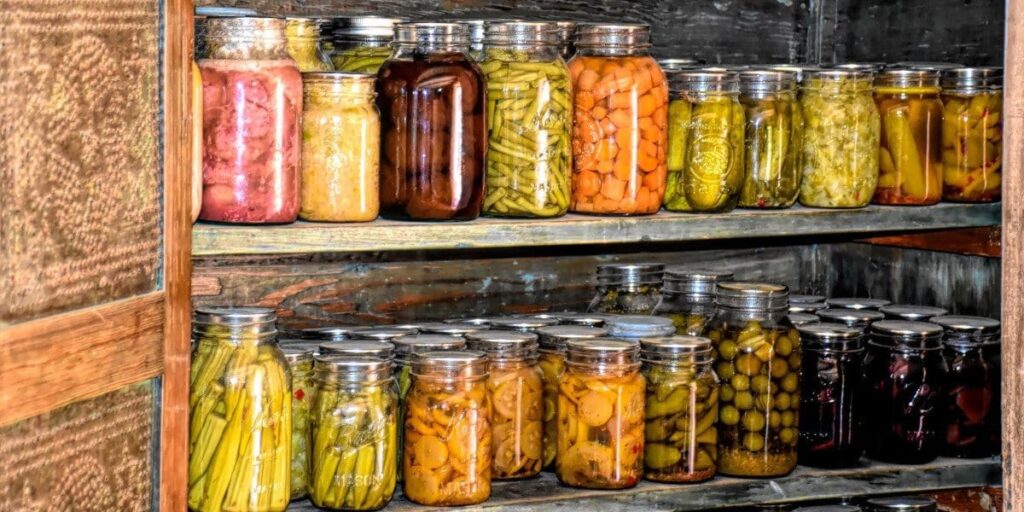 rows of cans in canning pantry