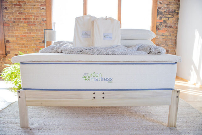 Organic latex mattress topper on bed for added comfort and support