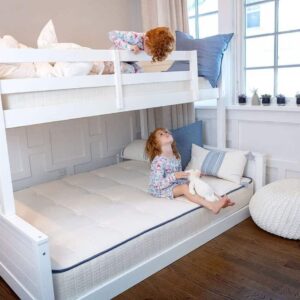 Two children playing on Pure Eco Organic Kids Mattress on white bunk bed with organic bedding