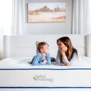 Mother and child on Kiwi Organic Mattress in bright nontoxic bedroom with organic bedding