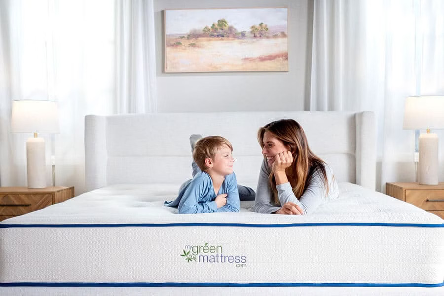 Mother and child on Kiwi Organic Mattress in bright nontoxic bedroom with organic bedding