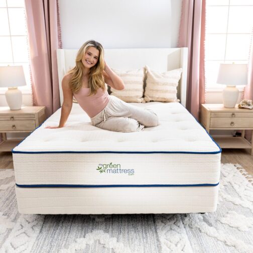 Woman relaxing on the Kiwi Organic Mattress, crafted with organic latex for gentle, contouring support.