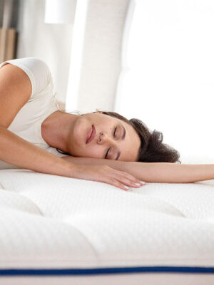 woman sleeping on mattress