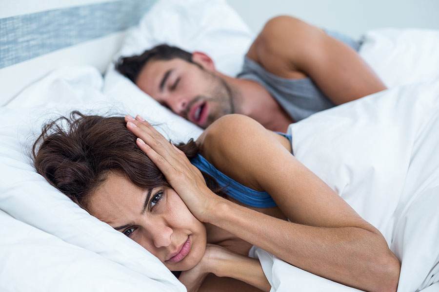 What to Do When You or Your Partner Snores: Tips & Remedies