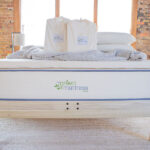 My Green Mattress organic bedding bundle in package on a bed