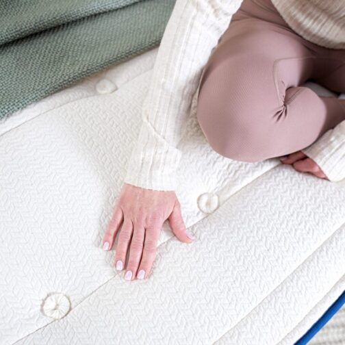 A close-up of the Natural Escape organic mattress showing its hand button tufting for added durability and comfort.