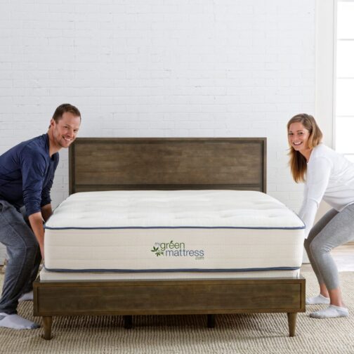A couple lifting and rotating their Natural Escape organic mattress to follow proper care and maintenance guidelines.