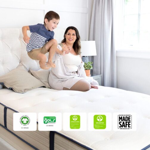 A mom and young child sitting on the My Green Mattress Natural Escape organic mattress, showcasing GOTS, GOLS, GREENGUARD Gold, UL Validated, and MADE SAFE certifications.