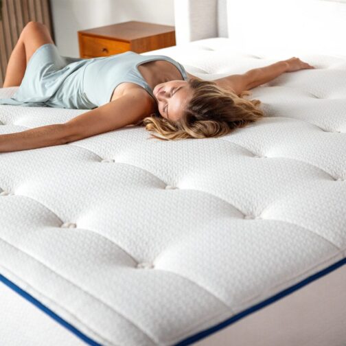 A woman relaxing on the Natural Escape mattress, which features the Madison Spring System for targeted, full-body support and enhanced comfort.