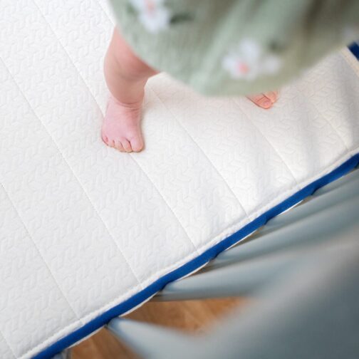 Close-up of the Emily Organic Crib Mattress showing firm, supportive innerspring design for infants and toddlers.
