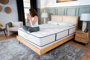 Woman-drinking-coffee-comfortably-on-My-Green-Mattress-mattress
