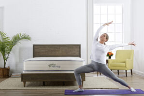 woman-doing-yoga-next-to-bed