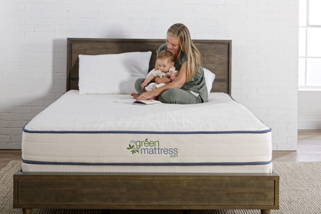 mom and child sitting on an organic mattress